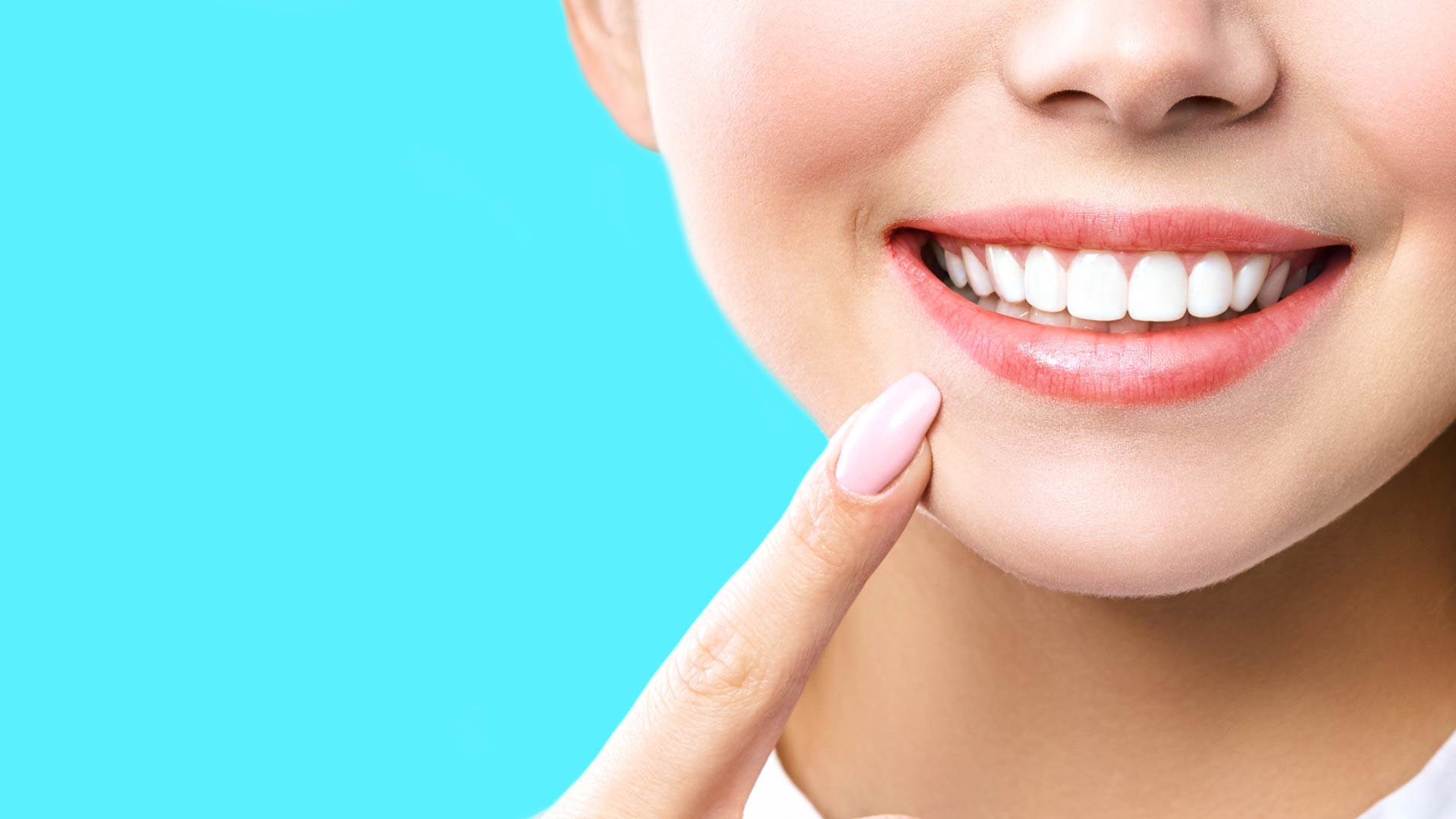 a close-up of a woman's face with teeth whitening